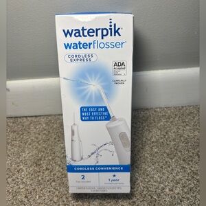 NIB Waterpik Cordless Water Flosser, Battery Operated & Portable for Travel